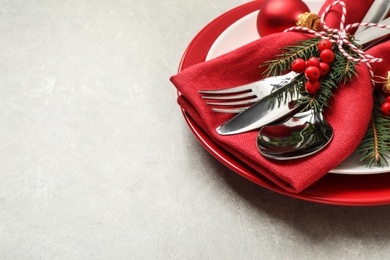 Photo of Beautiful Christmas table setting on light grey background. Space for text