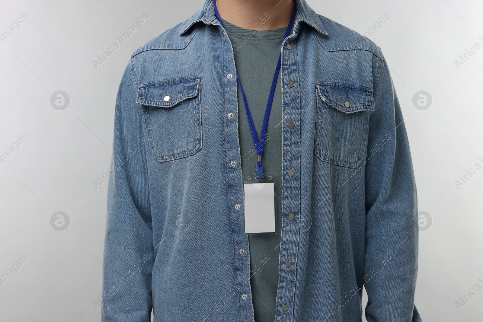 Photo of Man with blank badge on grey background, closeup