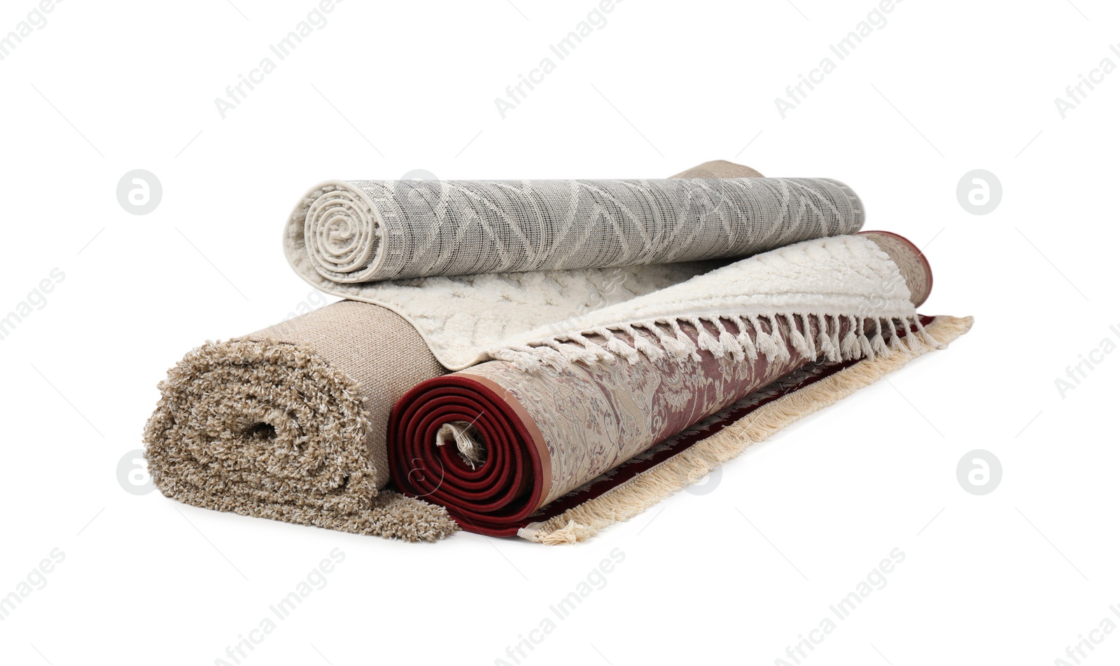 Photo of Rolled carpets on white background. Interior element