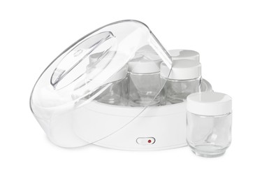 Modern yogurt maker with empty jars on white background