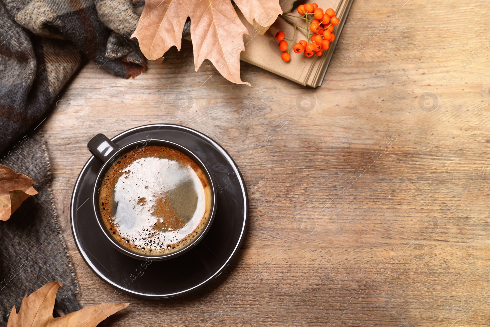 Photo of Flat lay composition with hot drink on wooden background, space for text. Cozy autumn