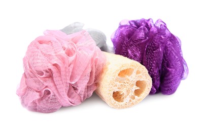 Photo of New shower puffs and loofah sponge on white background. Personal hygiene