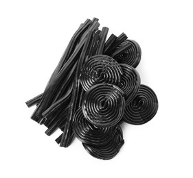 Pile of tasty liquorice candies on white background, top view