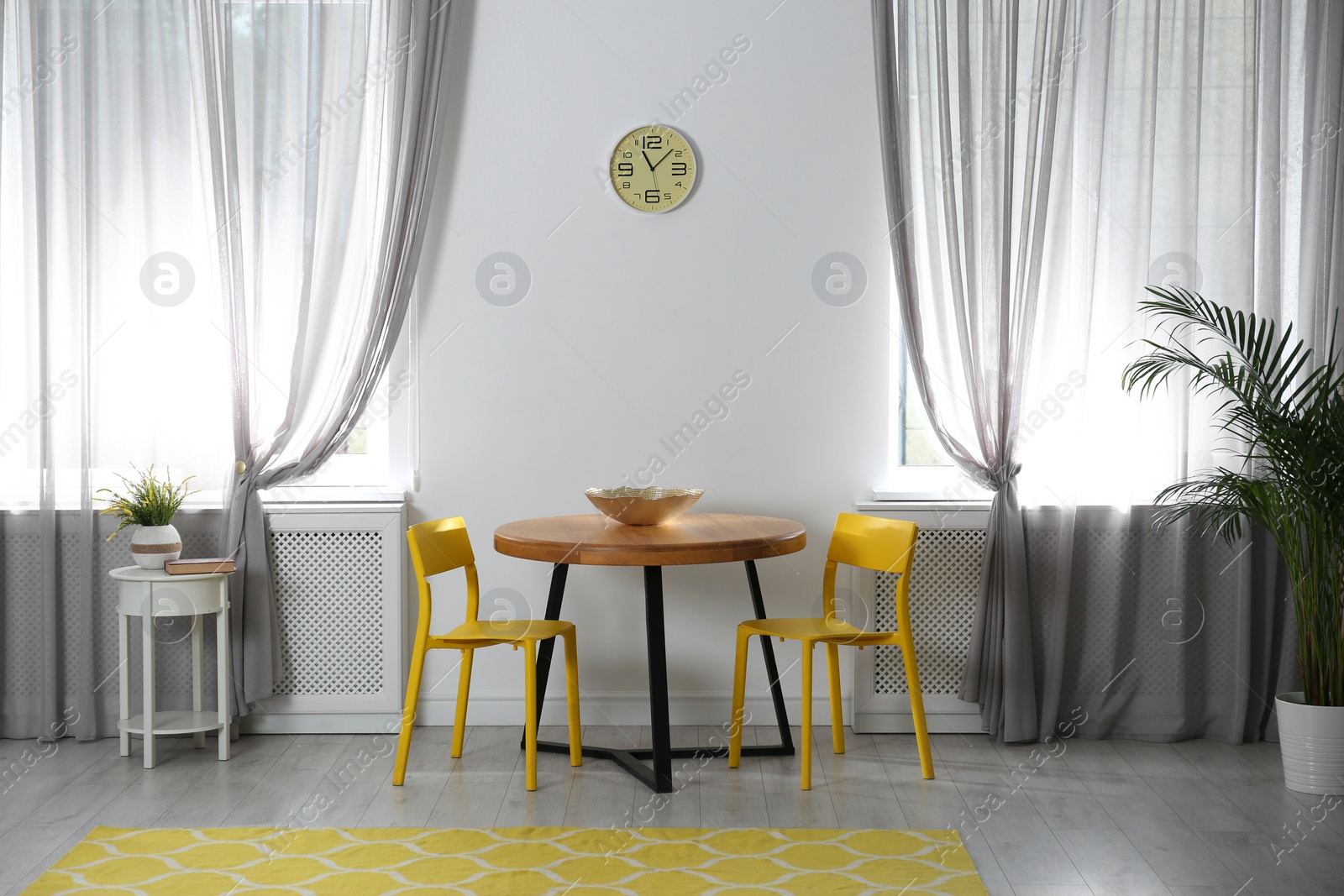 Photo of Room with comfortable table, chairs and stylish decor. Idea for interior design