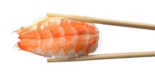 Chopsticks with delicious nigiri sushi isolated on white, top view