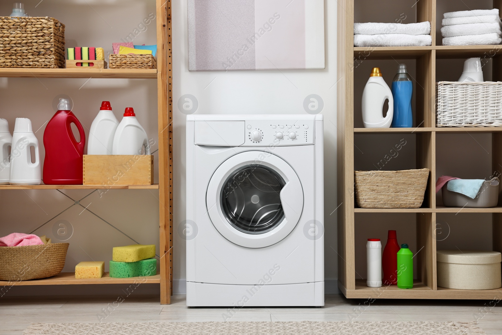 Photo of Laundry room interior with washing machine and furniture