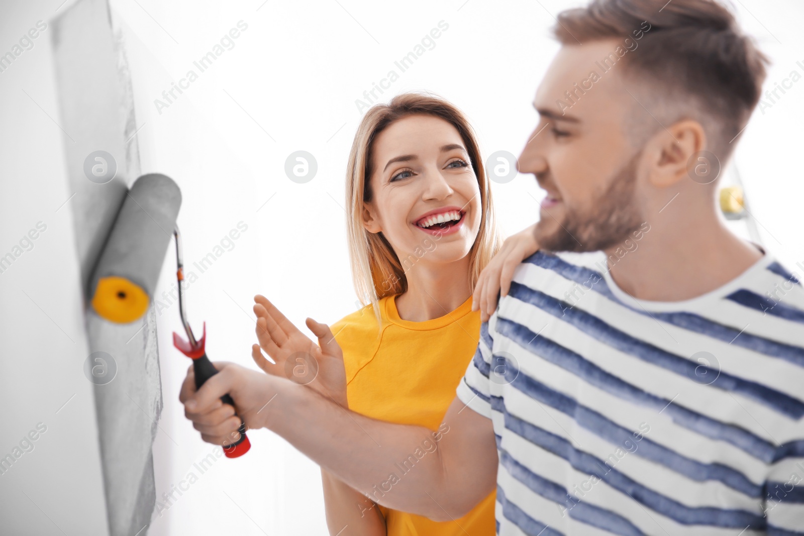 Photo of Young couple during apartment renovation, indoors