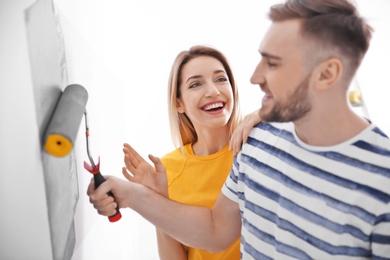 Photo of Young couple during apartment renovation, indoors