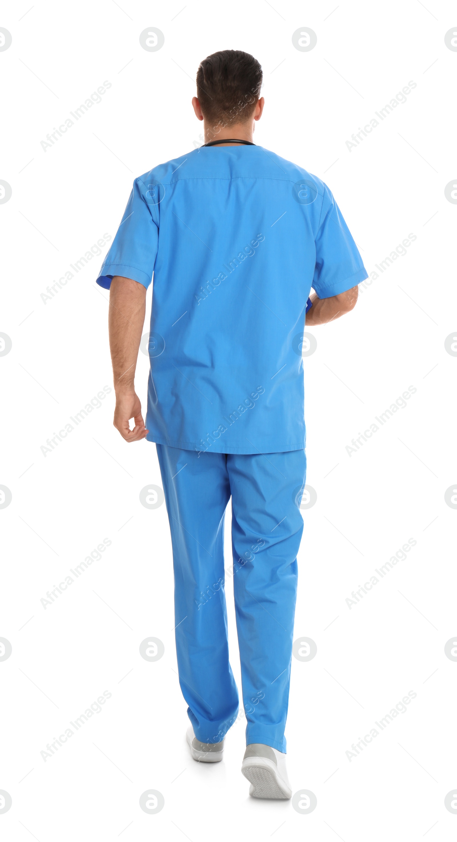 Photo of Doctor in uniform walking on white background