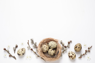 Flat lay composition with quail eggs on white background, space for text. Easter celebration