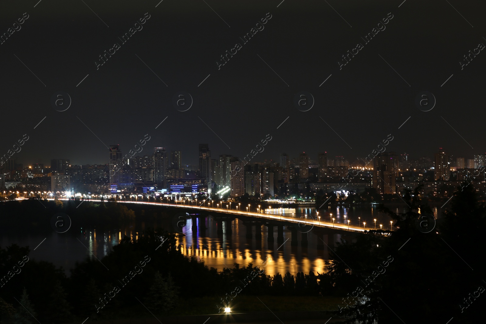 Photo of Beautiful view of bridge with illumination in modern city at night