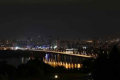 Photo of Beautiful view of bridge with illumination in modern city at night