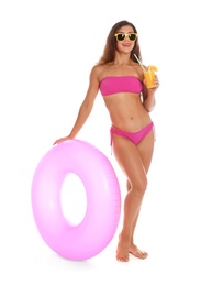 Photo of Beautiful young woman with inflatable ring and glass of cocktail on white background