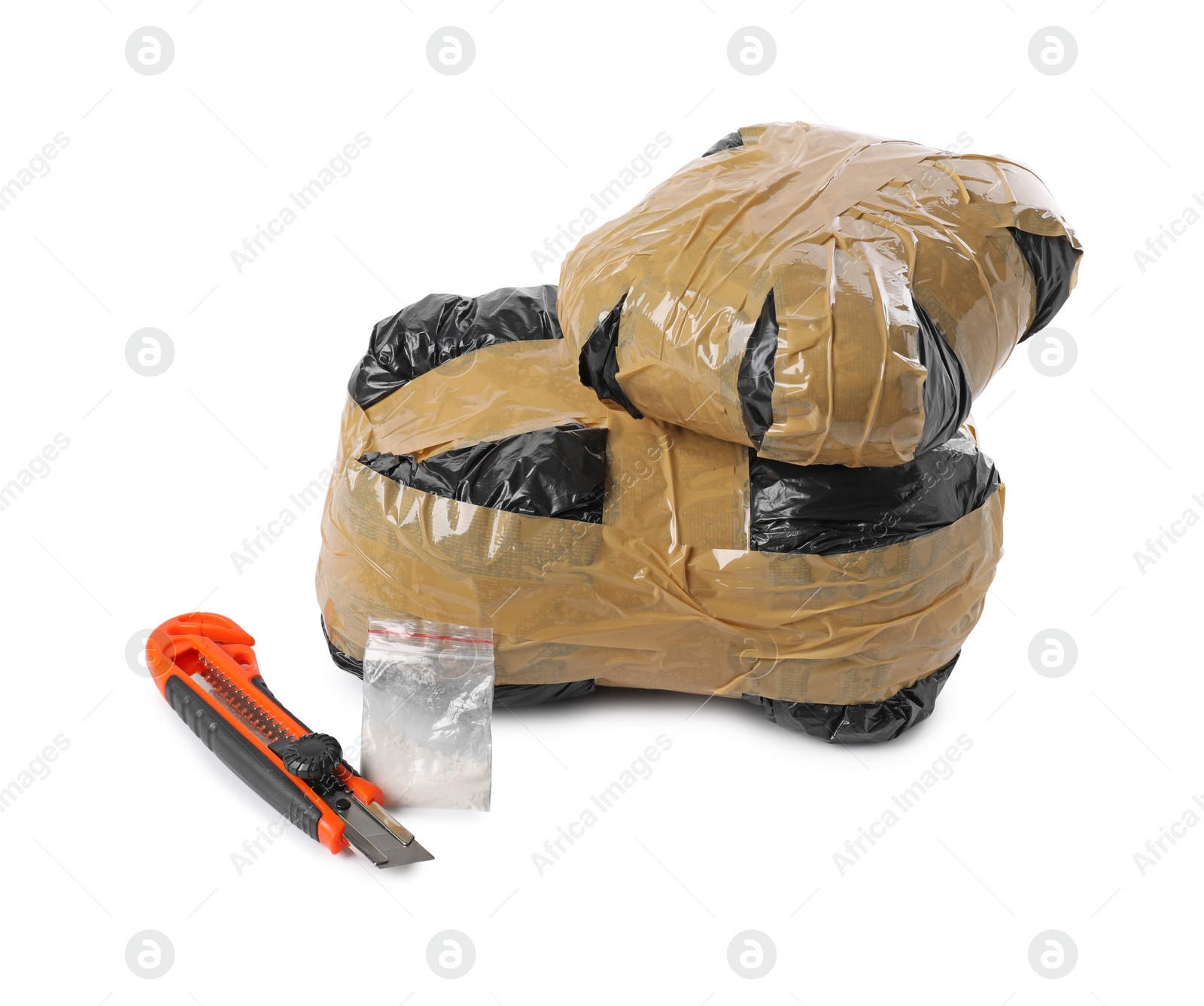 Photo of Packages with narcotics and stationery knife isolated on white