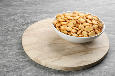 Delicious goldfish crackers in bowl on table