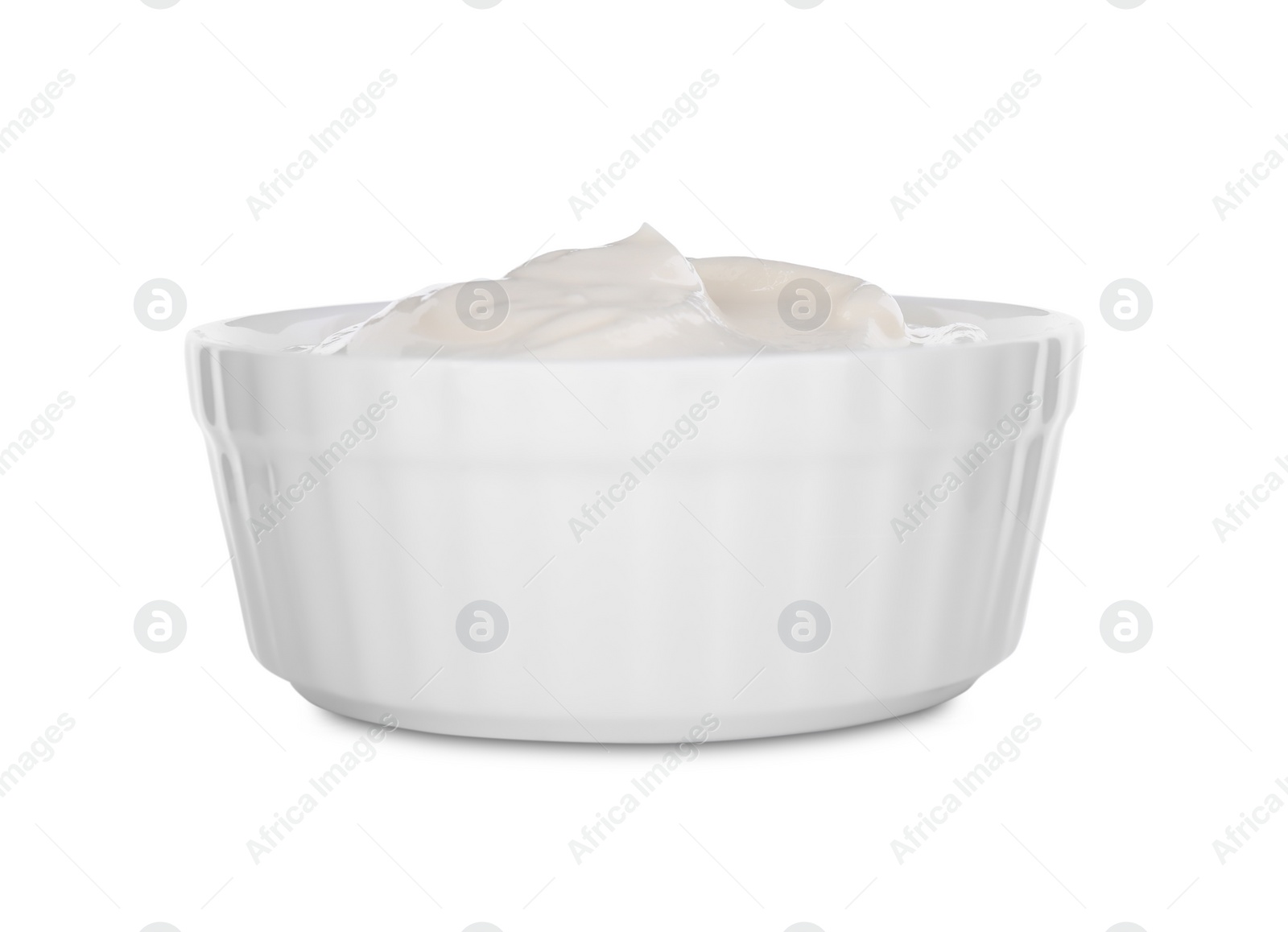 Photo of Bowl with sour cream isolated on white