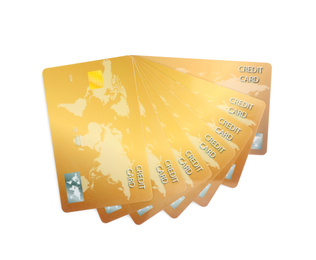 Photo of Golden plastic credit cards on white background