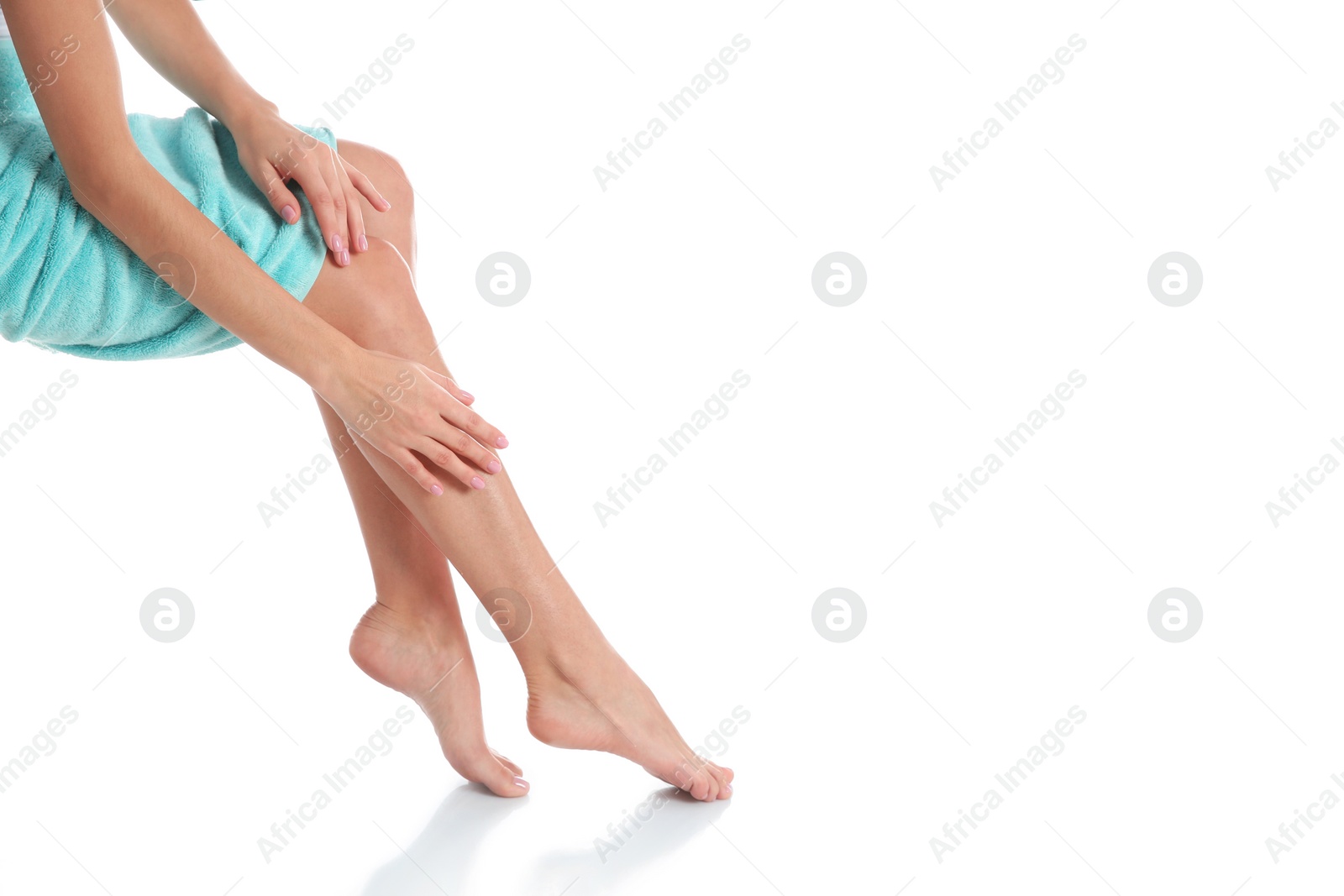 Photo of Woman with beautiful legs and feet on white background, closeup. Spa treatment