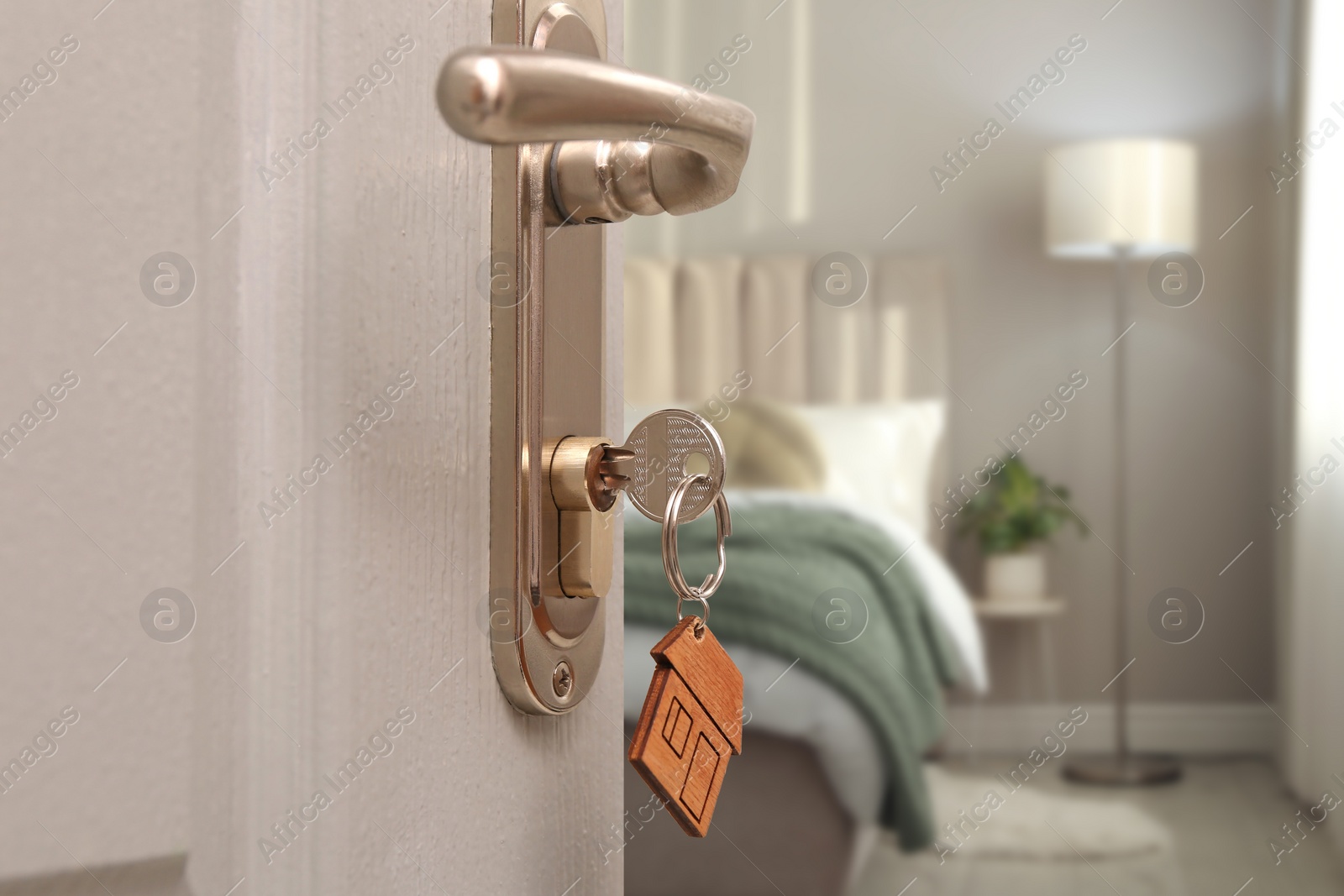 Image of Closeup view of door with key open in bedroom 