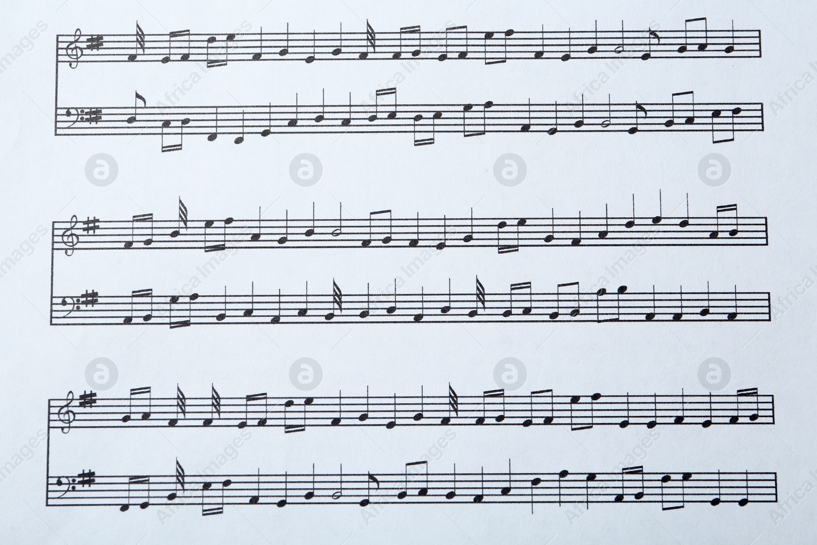 Photo of Paper sheet with musical notes, closeup view