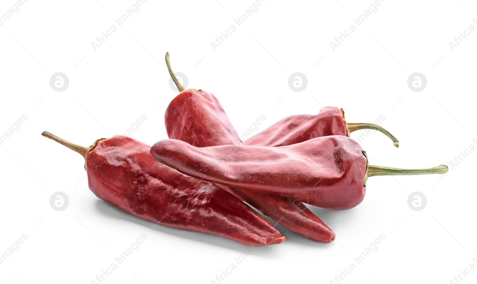 Photo of Dry chili peppers on white background