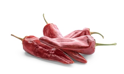 Photo of Dry chili peppers on white background