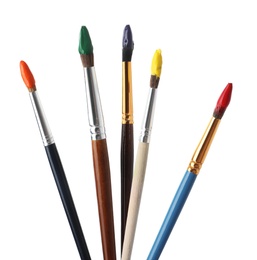 Photo of Different brushes with paints on white background