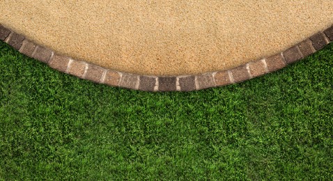 Image of Fresh green grass, stone tiles and sand outdoors, top view. Banner design