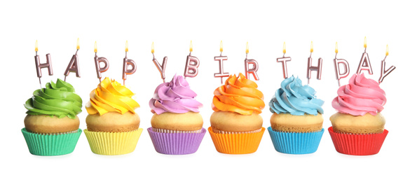 Photo of Birthday cupcakes with candles on white background