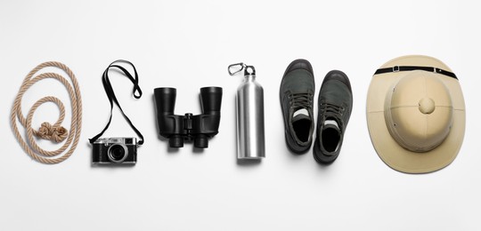 Photo of Flat lay composition with different safari accessories on white background