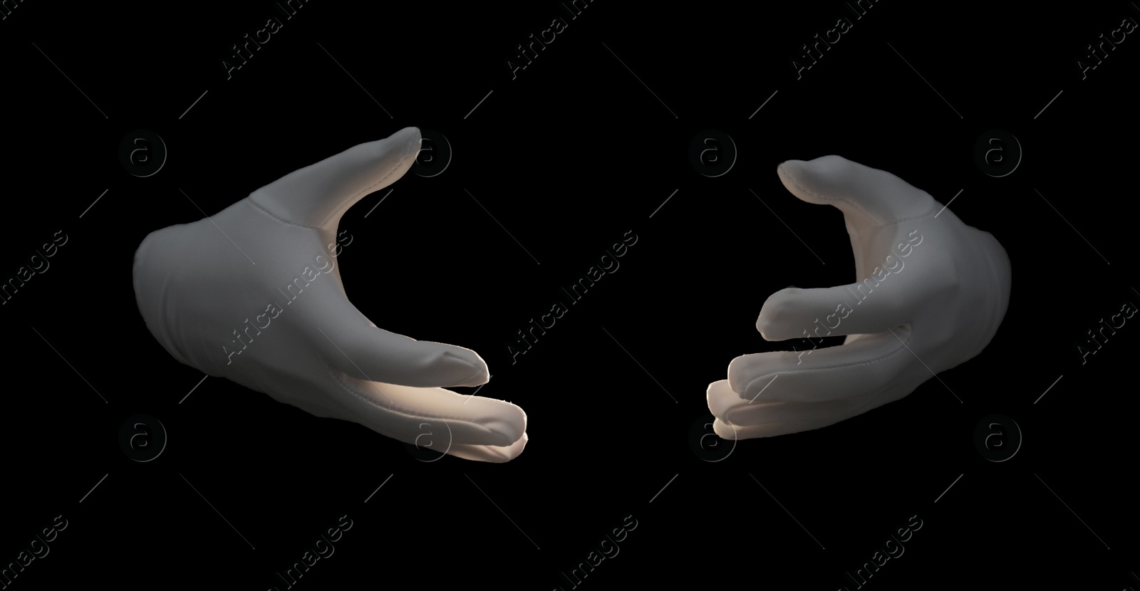 Photo of Magician holding something on black background, closeup