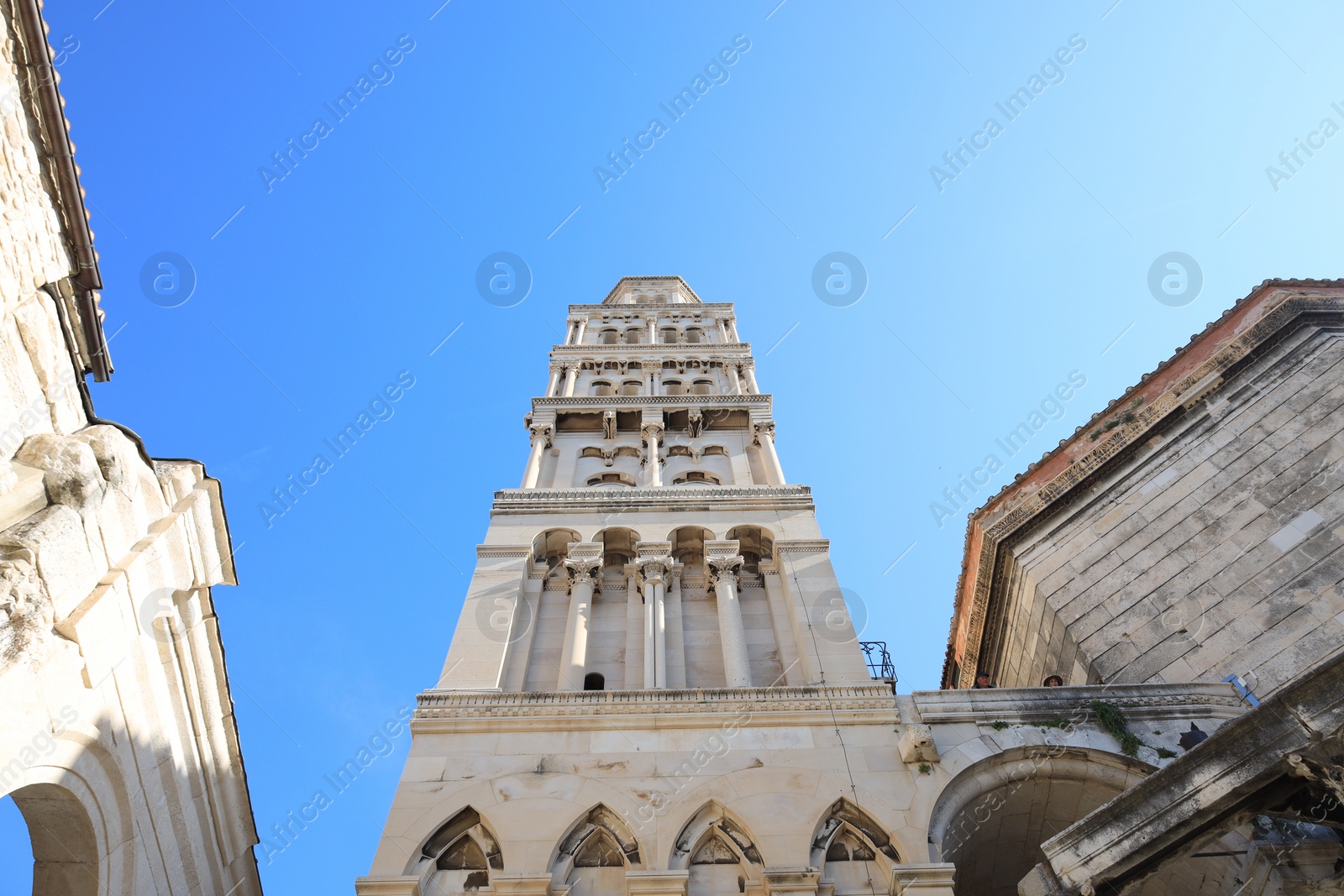 Photo of Beautiful old building against light blue sky, low angle view