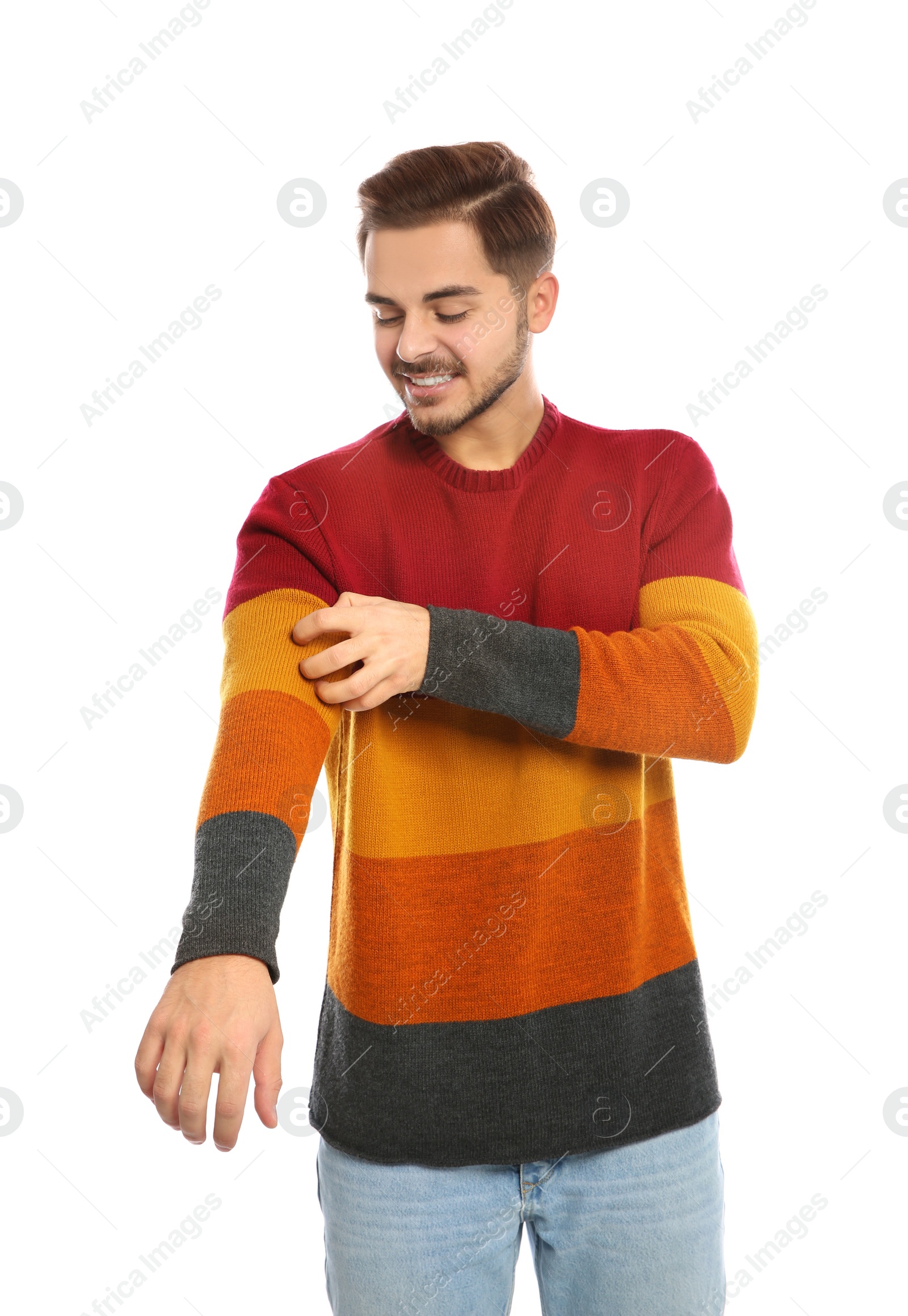 Photo of Young man scratching arm on white background. Annoying itch