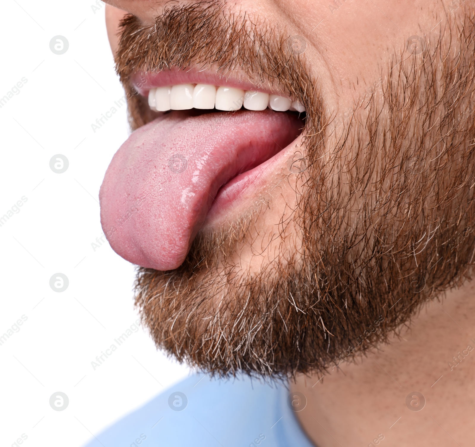 Photo of Man showing his tongue on white background, closeup