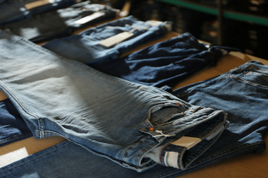 Photo of Stylish blue jeans on display in shop