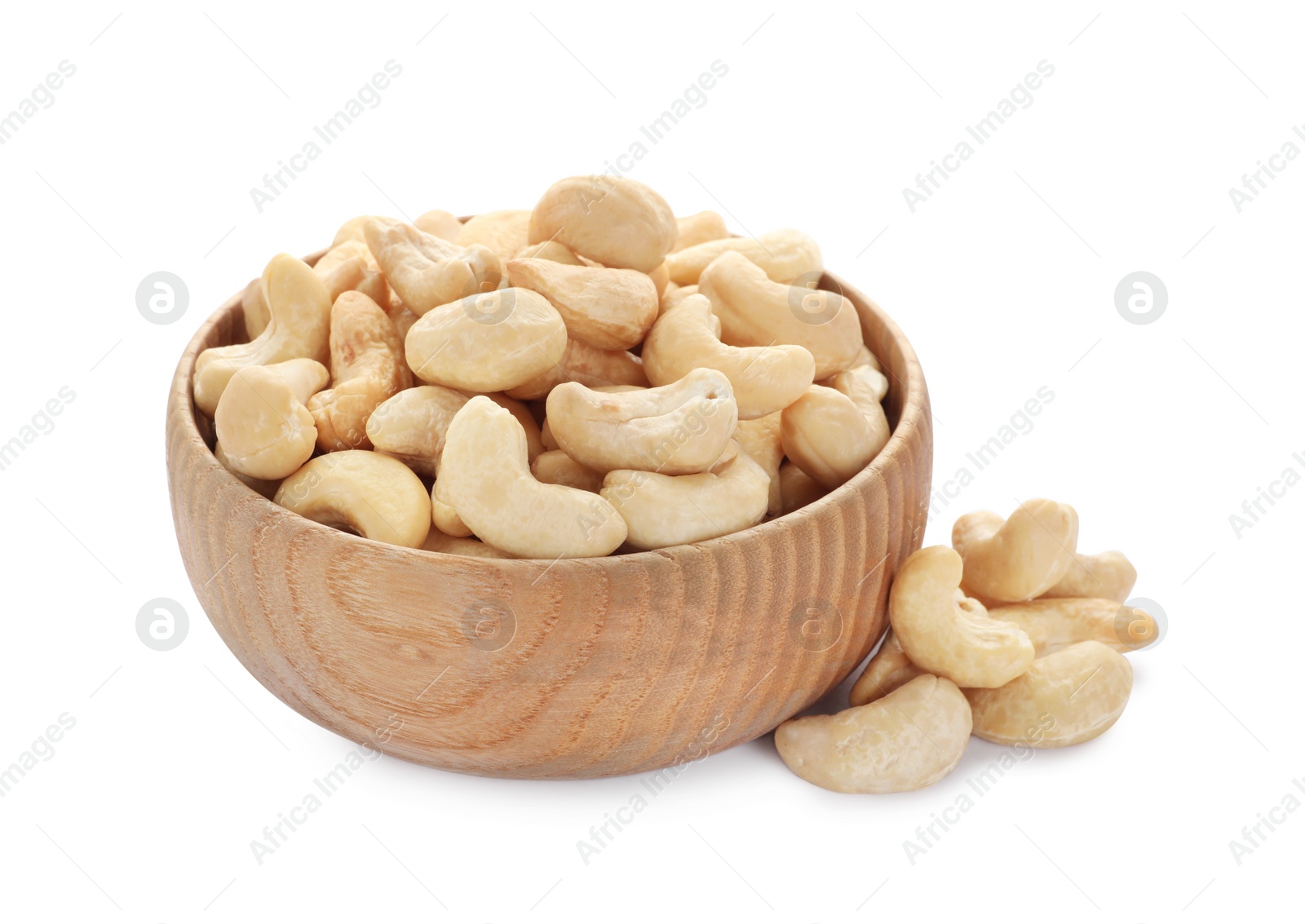 Photo of Bowl and tasty organic cashew nuts isolated on white