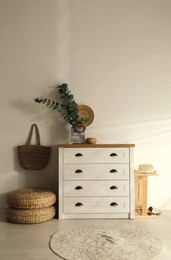 Photo of Chest of drawers in stylish room interior
