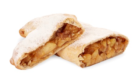 Delicious cut strudel with apples, nuts and raisins isolated on white