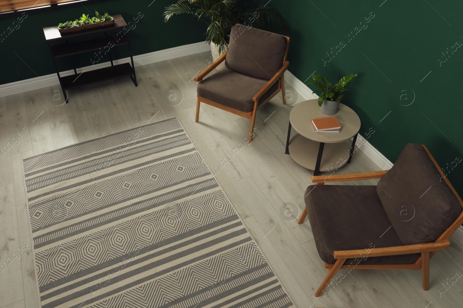 Photo of Stylish rug with pattern on floor in room, above view