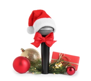 Microphone with Santa hat and decorations isolated on white. Christmas music concept