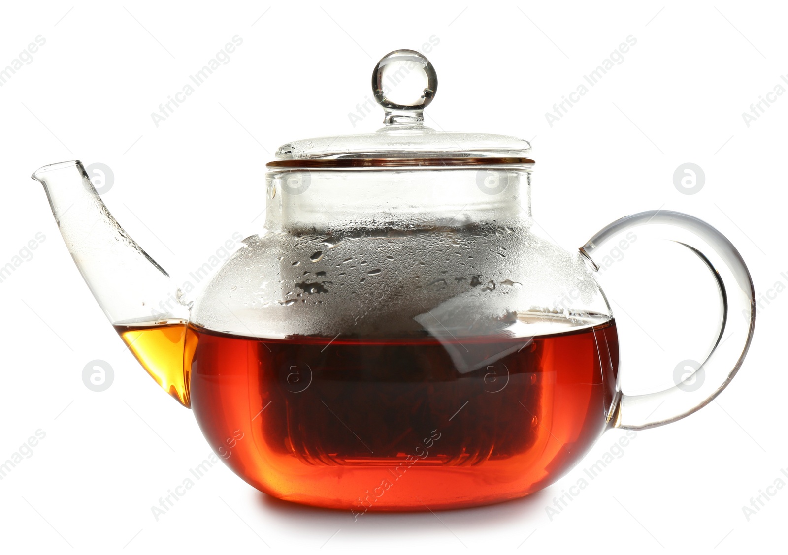 Photo of Glass pot with hot tea isolated on white