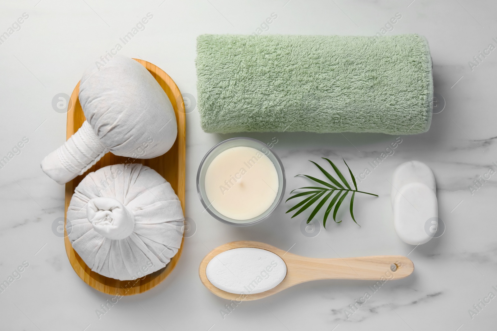 Photo of Flat lay composition with different spa products on white marble table