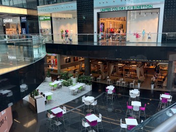 Photo of WARSAW, POLAND - JULY 23, 2022: Food court interior in shopping mall
