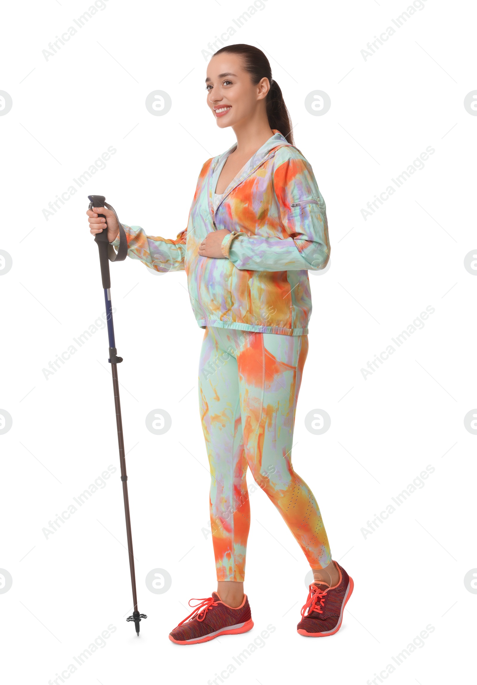 Photo of Pregnant woman practicing Nordic walking with pole isolated on white