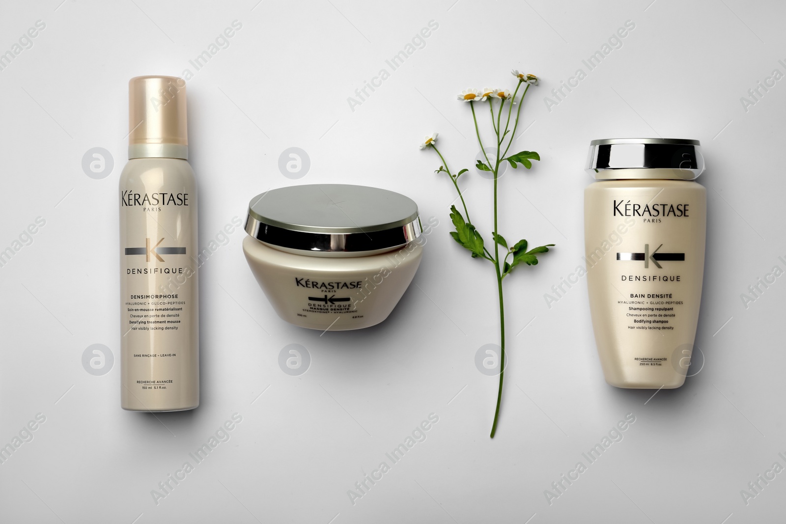 Photo of MYKOLAIV, UKRAINE - SEPTEMBER 07, 2021: Flat lay composition with Kerastase hair care cosmetic products on light background