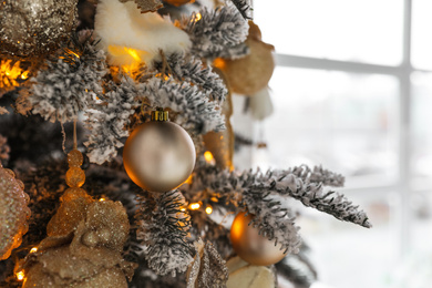 Beautiful Christmas tree Indoors, closeup. Festive interior decoration