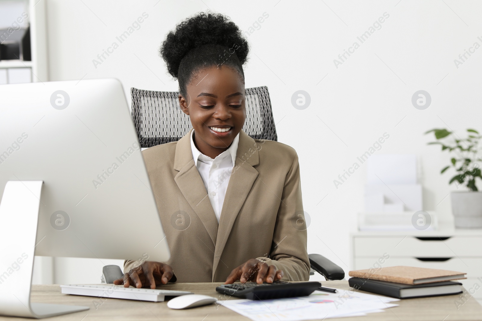 Photo of Professional accountant working on computer at wooden desk in office. Space for text