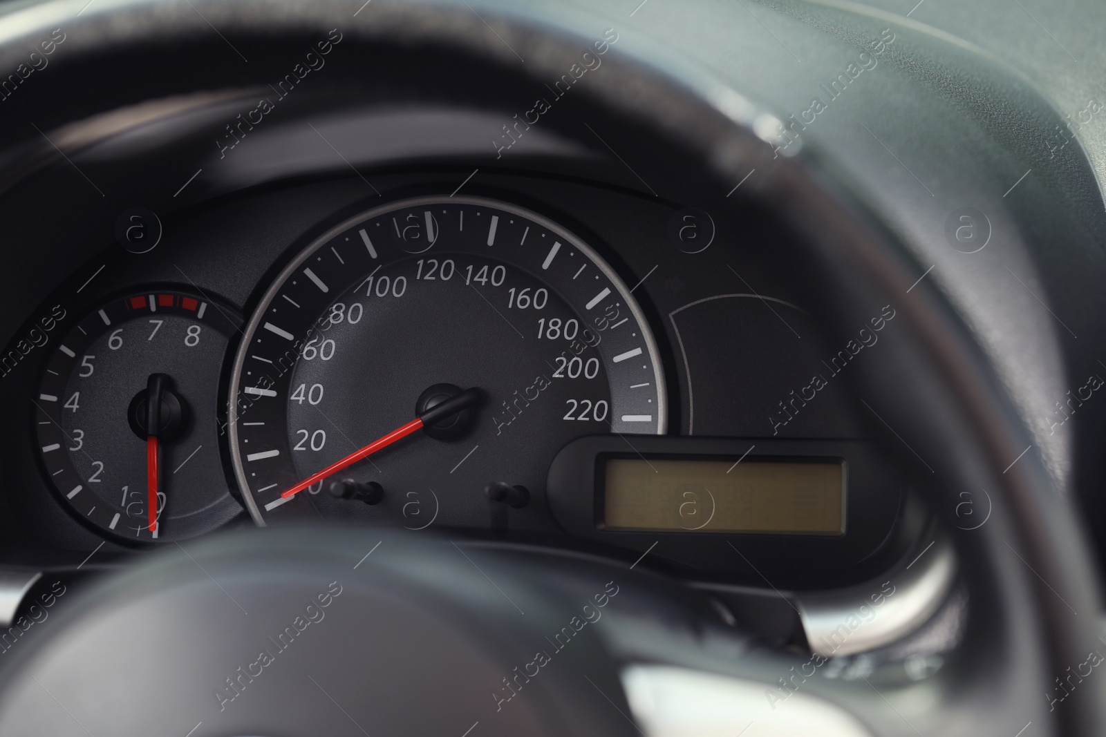 Photo of Speedometer and tachometer on modern car dashboard