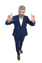 Photo of Mature businessman in stylish clothes posing on white background, above view