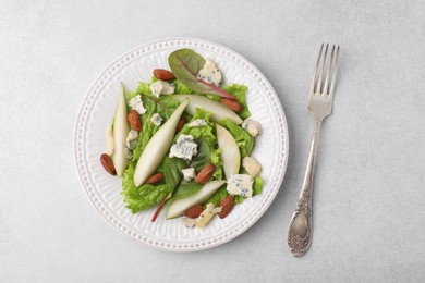 Photo of Delicious pear salad on light table, top view